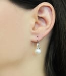 Model is wearing Elegance earrings with 9-10mm AAAA quality pearls